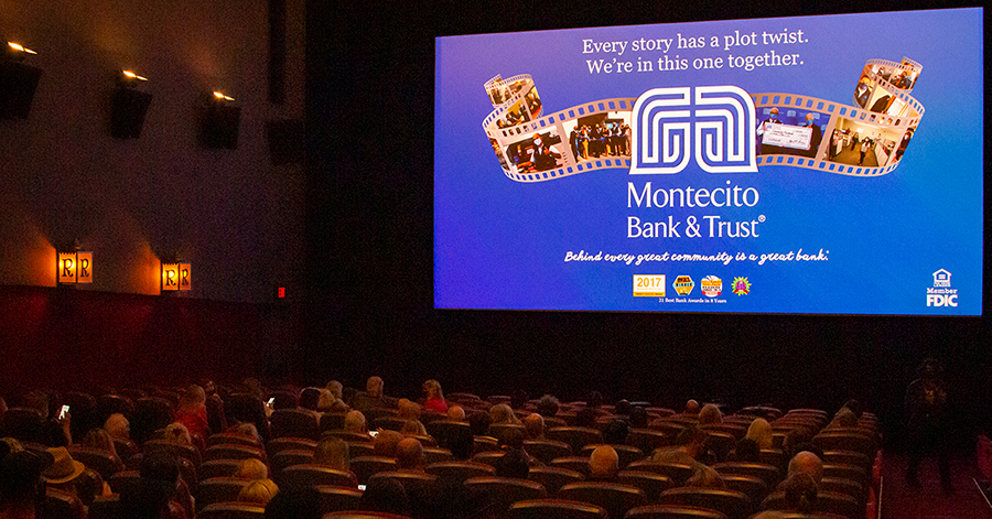 Family audiences and concession queues in a multiplex lobby during a busy weekend of cinema advertising